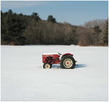 Tractor in snow covered field.
